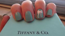 lulamaegolightly:  Since “For Audrey” is supposed to be Tiffany Blue, I wanted to take a pic with a Tiffany box for comparison. And I thought I’d do a little ode to the box itself with my accent finger. China Glaze, “For Audrey”Sinful Colors,