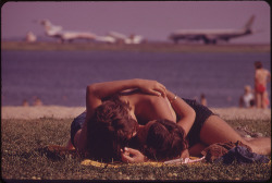 youlikeairplanestoo:  I can think of few things more romantic than planespotting at the beach ;) Neat vintage photo of this couple “planespotting” at Constitution Beach across from Boston Logon International Airport (circa 1973). Photo by Michael