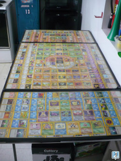 thedrunkenmoogle:  Pokemon Card Beer Pong Table After considering making a beer pong table out of other collectable objects, such as bottle caps and fortune cookies, Tom Sejkora took the geekier route and created a beer pong table out of his old Pokemon