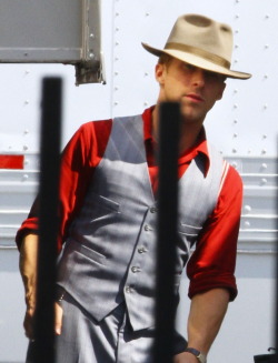 pocketsfullofpearls:  hollywoodbulletin:  Ryan Gosling kills us all with his devilishly good looks on the set of his next film, The Gangster Squad, on Tuesday, September 13. Ryan just got back from the Toronto International Film Festival and went straight