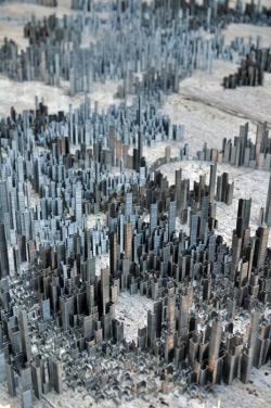 marukido:  The artist Peter Root, from Guernsey, spent 40 hours standing 100,000 staples on end to build his latest work of art: New York-style miniature city made from staples. And he’ll take just seconds to destroy it - by knocking it over with marbles.