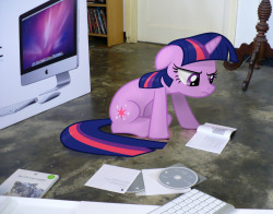 kevinsano:  Guess it’s time I did one from ‘scratch’ instead of editing the Fluttershy ones.  Twilight helping me set up my computer. Can’t say she agrees with my choice. vectors are from http://mlp-vectorclub.deviantart.com/   Oh Twilight.