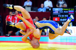 thebeautyofsports:  American Cael Norman Sanderson (left) wrestles with Russia’s Albert Saritov during their freestyle 84 kg bronze medal match at the Senior Wrestling World Championship in Istanbul September 17, 2011. (Photo by Mustafa Ozer) (via