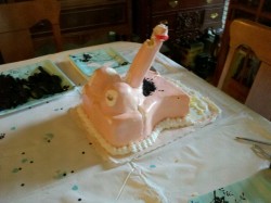 sexuallyactivepuppies:  Here’s the cake from my cousins bridal shower. The reason it’s so beat up is because they blind folded her and made her take a bite and then my aunt tried to cut it off. (There is a stick inside to support it so she couldn’t.)