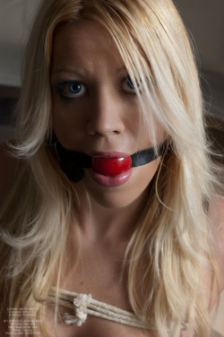 felixdartmouth:  Lindsay, photo by Felix Dartmouth - www.archw.com - She did well at her auction, garnering a credit amount above the mean.  After the hammer deposed her as a slave, she was gagged, and shackled in the back.  Her new master, an Arab