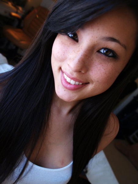 Asian babe toys her snatch