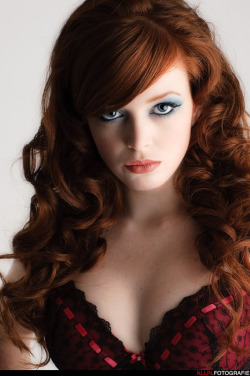 A beautiful bra, and lovely redhead, perhaps her hair color is a bit enhanced, but all together a lovely looking girl.