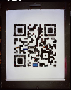 thingsorganizedneatly:  SUBMISSION: To promote the launch of his new website and blog, London-based photographer David Sykes decided to create a QR code out of objects such as boots, calculators, briefcases, boomboxes and champagne bottles. The QR