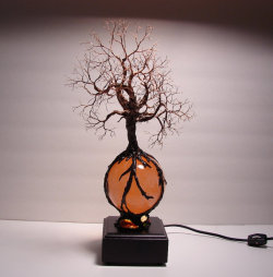 wickedclothes:  Tree of Life with Light Base This Tree of Life sculpture is placed upon a polished, natural selenite sphere. Sold on Etsy. 