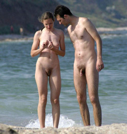 nudecouples:  nudistlifestyle:  Nudist couple at the beach. I think she has a sore finger !  o kiss it better 