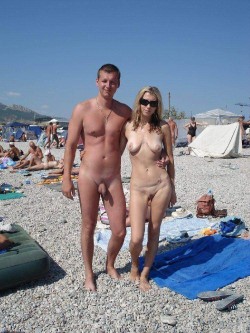 nudistlifestyle:  Nudist couple at the beach.  hip
