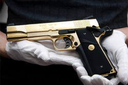 visualcocaine:  Springfield Armory 1911A1, Gold Plated. 