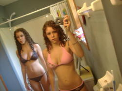 Two curly haired hotties in their bikinis