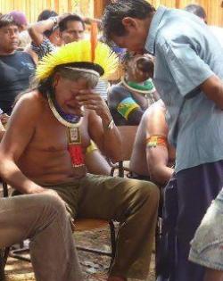 cosmic-noir:  deletethisstuffff:  reactiveprocess:  Fucked….   I hope that this image travels the world …“While newspapers and television talk about the lives of celebrities, the chief of the Kayapo tribe received the worst news of his life: Dilma,