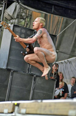 It&rsquo;s hard to believe how hot Flea is after all this time. wetdreamoblackdom:  RHCP has been a smokin’ hot band for many years.  Flea is one huge reason for that. 