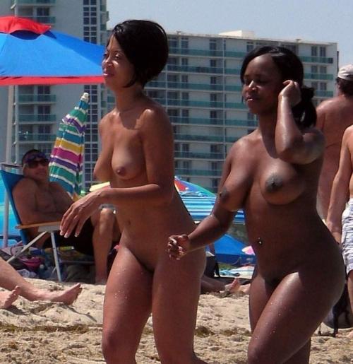 Topless ebony teen on the beach