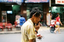 Chain smoker Saigon.  Please vote for this photograph:  https://apps.facebook.com/hyly-contest-app/1395230243781544779/entry?eid=1395633604388387746&amp;fb=1&amp;votes_list