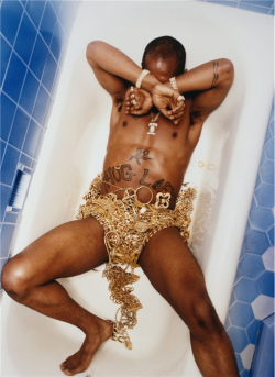 survivaltacticss:  jaepacaveli:  Pac’s infamous bathtub photo, covered in gold chains and medallions. I wanna take a similar photo one day.  HIPHOP ISNT DEAD 