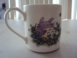 fyeahmiyazaki:  aefergmugblog:  Mug featuring art from My Neighbor Totoro. Purchased at the Ghibli Museum in Mitaka, Tokyo.  I think that’s Kittenbus and basically, this is adorable.  