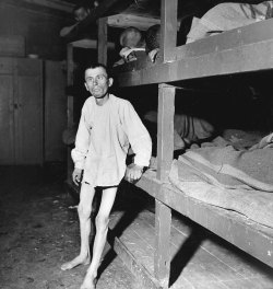 life:  The caption that accompanied this image when it appeared in the May 7, 1945, issue of LIFE: “Deformed by malnutrition, a Buchenwald prisoner leans against his bunk after trying to walk. Like other imprisoned slave laborers, he worked in a Nazi