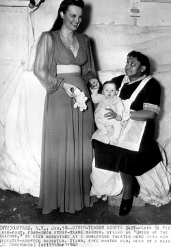    Lois DeFee   aka. &ldquo;Queen of the Amazons&rdquo;.. An AP wire photo from January of ‘42, highlighting Lois&rsquo; recent adoption of a 5 month-old baby girl that she has named: &ldquo;Starr&rdquo;.. Photo courtesy of the Janelle Smith collection..