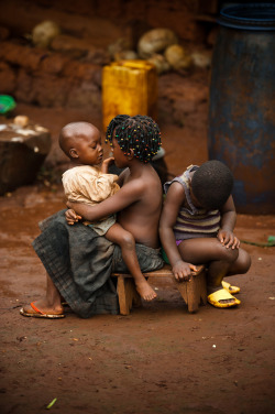 silatjunkie:  Children keep each other company outside their home in Cameroon Africa, 2011 