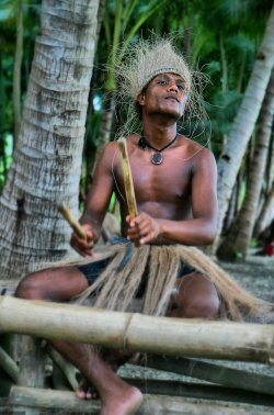 pinoy-culture:An Aeta man playing traditional music.