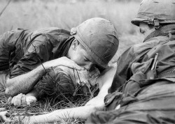 whoiscamjones:  Medic James E. Callahan of Pittsfield, Mass., gives mouth-to-mouth resuscitation to a dying soldier in war zone D, about 50 miles northeast of Saigon, June 17, 1967. Thirty-one men of the 1st Infantry Division were reported killed in the