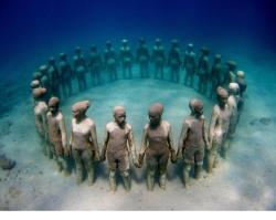     Underwater sculpture, in Grenada, in honor of our African ancestors thrown overboard.   I couldnt not reblog this, it’s so powerful to me.  oh my god. 