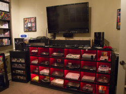 albotas:  A Little Bit On The Epic Gaming Room Side: This perfect gamer cave belongs to 16bitghost. Dude basically owns every console which makes his life pretty much 100% more fulfilling than yours. (via Geekologie) 