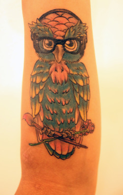 fuckyeahtattoos:  Johnny Cupcakes inspired owl. The headphones are for my younger brother who is the only person I know that appreciates music as much as I do. The hipster glasses are the same exact ones that my youngest brother wears. (Prescription