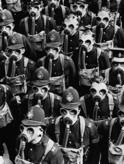 itsjohnsen:  London policemen wear gas masks for a training drill, 1937. Bettmann Collection 