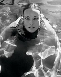 Black and white photo of Olivia Wilde in the pool