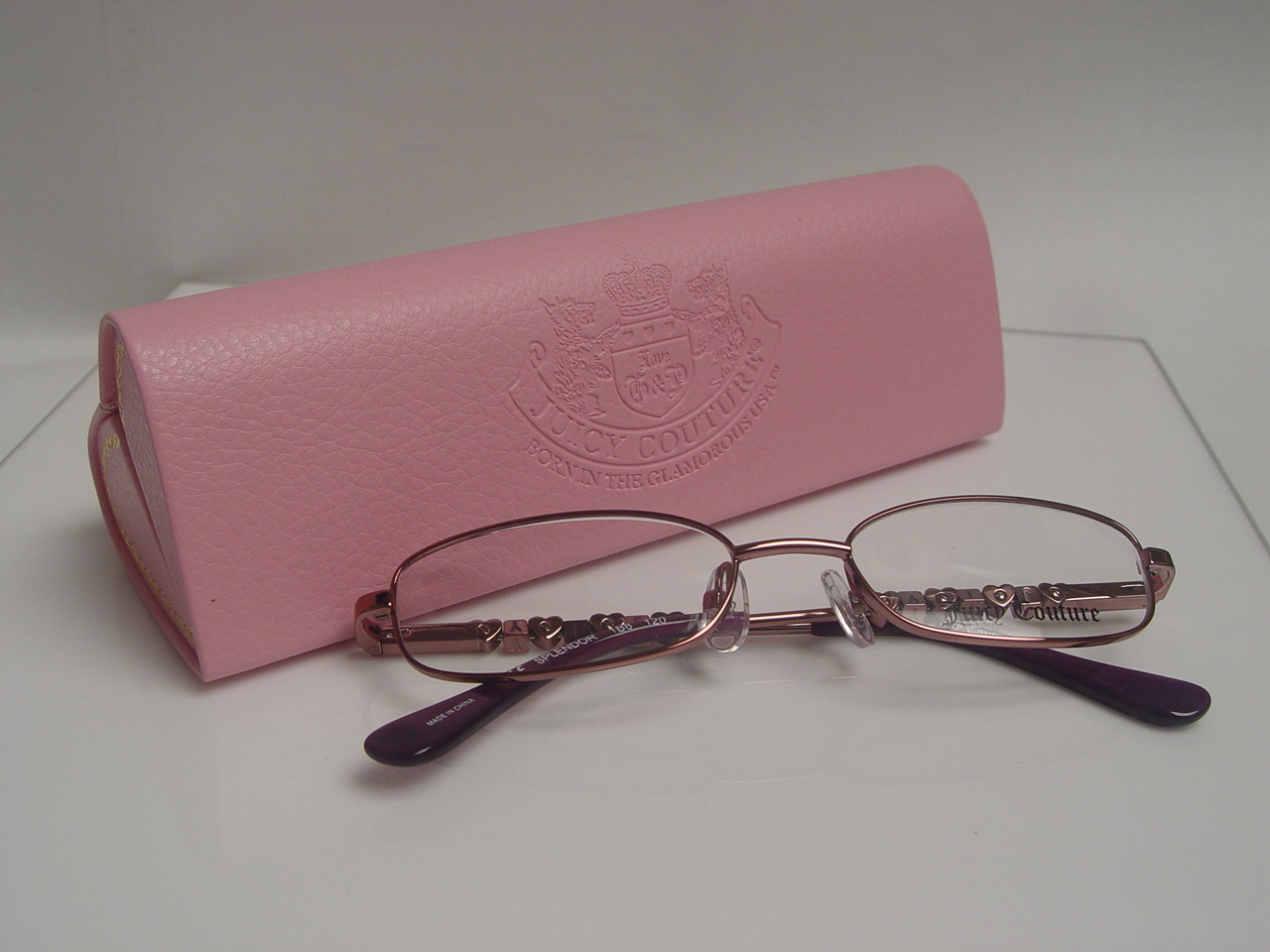 Juciy Couture Eyeglasses and pink heart shaped eyeglass case.