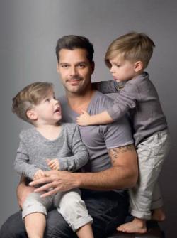 deathanddumb:  Ricky Martin and his angry little lesbian twins. WTF.