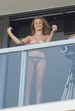 Rosie Huntington-Whiteley topless on a balcony