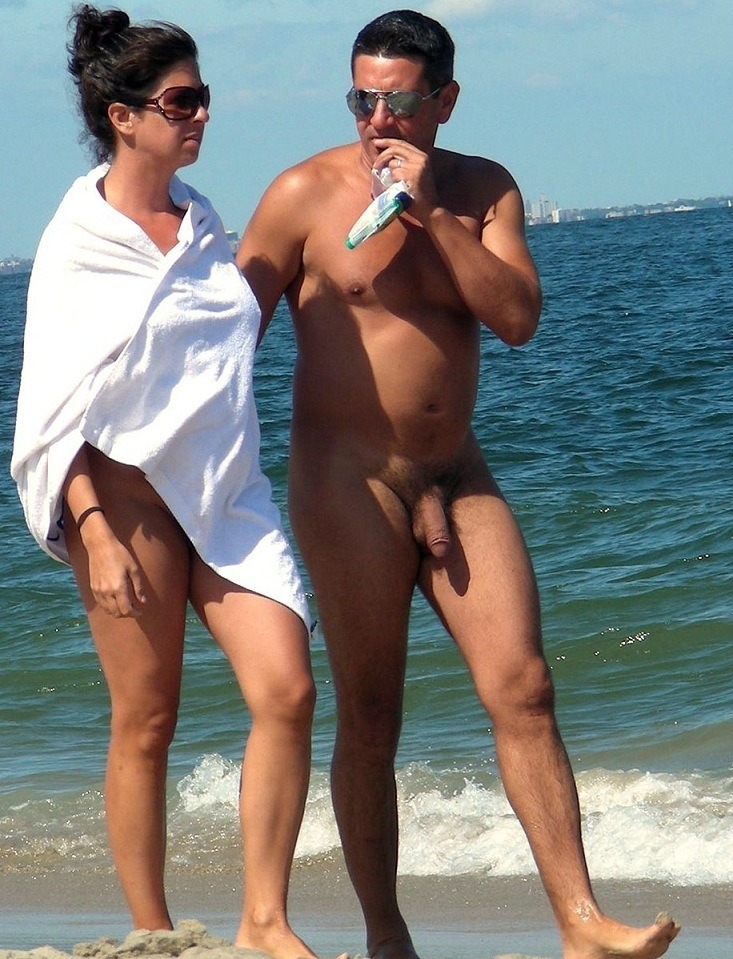 Couple spying on beach