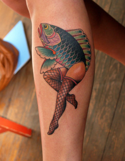 fuckyeahtattoos:  When she was little, she would ask her father “Will you draw me a mermaid?” And her father, to get a rise out of her, would reverse the mermaid concept by giving a fish the lady legs. Tattoo: Clay McCay   Savannah Ga.  at Anonymous