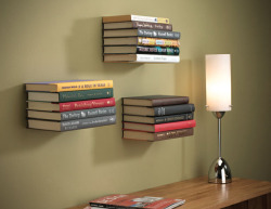 modernations:  Invisible Floating Wall Shelf by Umbra  Just as the name would suggest, this invisible book shelf screws directly into a wall stud, and creates the illusion that your reading material is simply floating on the wall. The conceal book shelf