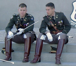 2manykinks:  White gloves, swords, sexy boots, and military uniforms. A gay guy MUST have come up with this look. 