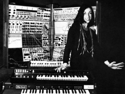 Seminal electronic composer Suzanne Ciani, smiling (yeah, SMILING!) in front of banks of mouth-watering synthesisers.   And composer of beautiful, thought provoking and humorous melodies.   Respect.