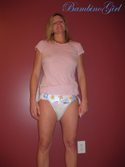bambinogirls-blog:  Daddy had me face the camera and told me to smile like a good baby girl. I really didnâ€™t want to smileâ€¦my diaper was heavy and coldâ€¦.and it really smelt bad!! I was really happy after Daddy put me in the shower and Pampered me.