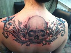 fuckyeahtattoos:  Backpiece done by Jay Rill and The Inkwell in Southampton, PA I always had a passion for skulls and the tribal and the stars and spatter just make the piece more badass! 