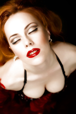From above, red lipstick red hair.