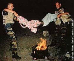 miss-haya:  heartlessmatters:  eastlondoner:  Something you would not have seen in the media: Two Belgian UN ‘peacekeepers’ cheerfully “roast” a Somali boy over a fire, during a ‘humanitarian mission’ in Somalia in 1993 Kurt Coelus and Claude