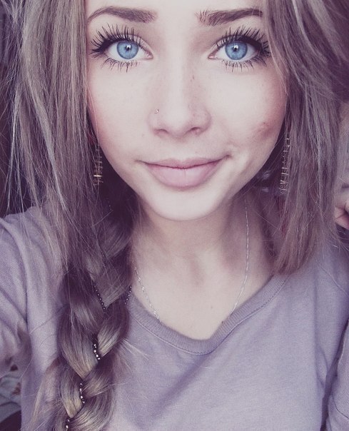Pretty girl with brown hair and blue eyes