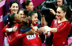 The USA Women’s Gymnastics Team celebrate after winning gold in the team finals.  USA USA USA!