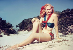Lynne O’Neill models one of her self-made swimsuits, somewhere in the dunes along one of Long Island’s many beaches..