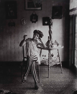silentcuriosity:  Storeyville Portraits, prostitute with striped stockings drinking Raleigh rye, E.J Bellocq photographer, New Orleans, 1912. Printed by Lee Friedlander 1967. 