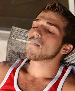smoke-sex:Sexy and buff Austin Ried is back jerkin his slicked up cock and CHAINSMOKIN a pack of Marlboro Menthols!